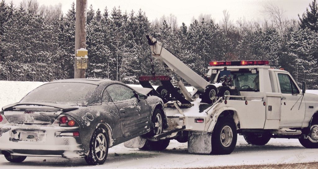 Car Towed on Snowy Road